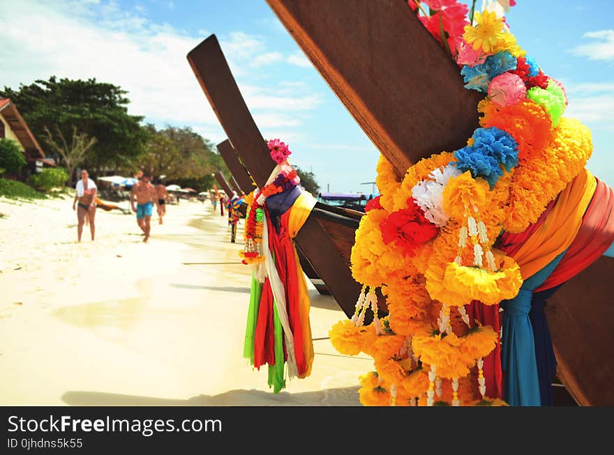 Closeup Photo of Brown Wooden Fence With Multi-colored Fabric Tie