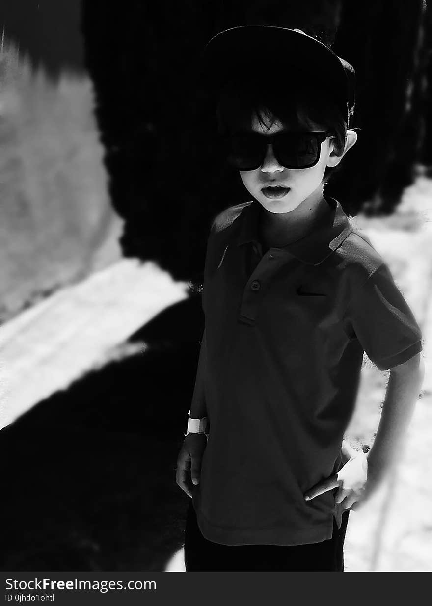 Grayscale Photography of Boy Wearing Polo Shirt and Sunglasses