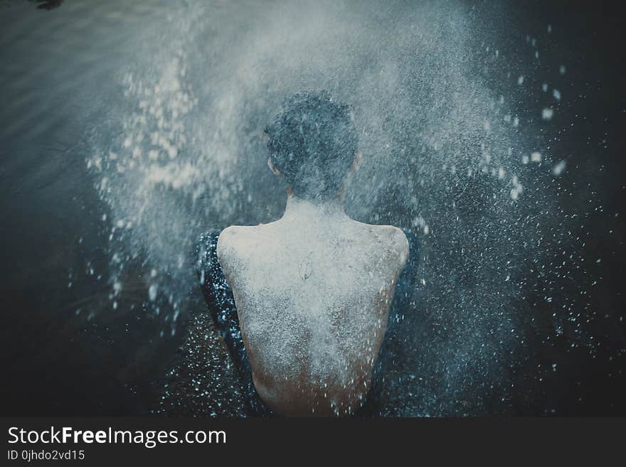 Person Splashing Powder on His Back