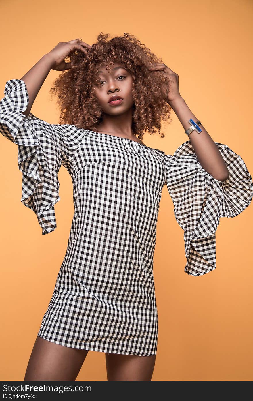 Woman Wearing White and Black Checkered 3/4 Sleeved Shirt