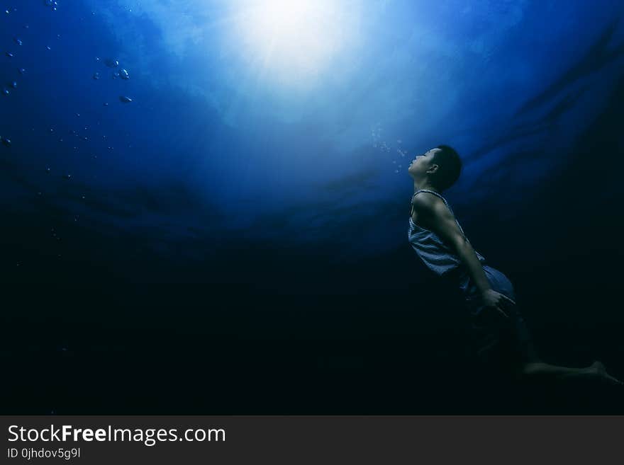 Painting of a Person Swimming Underwater