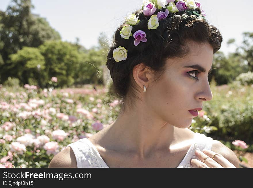 Close Up Photo of Woman With Floral Headband