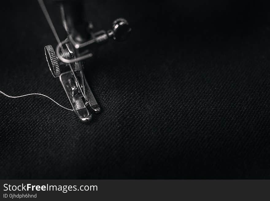 Closeup Photography of Presser Foot of Sewing Machine