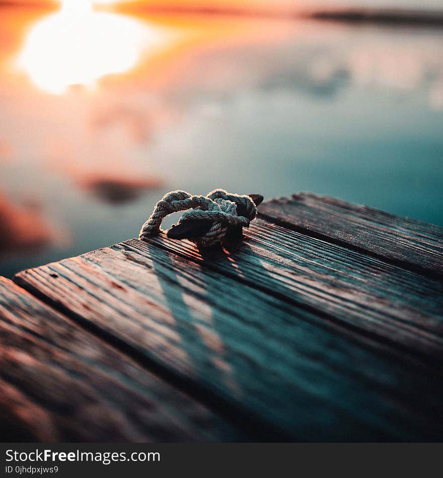 Gray Rope on Brown Wooden Board