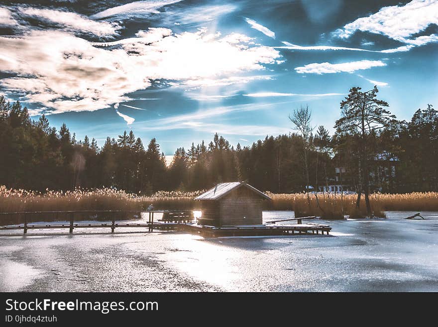 Brown Shack in the Middle of Frozen Lake