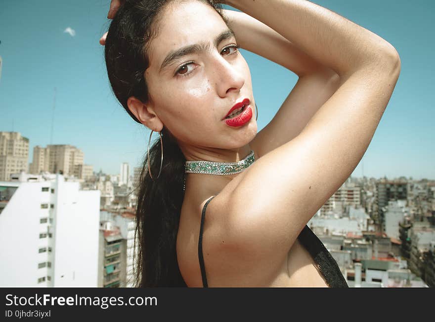 Woman Wearing Spaghetti-strap Top With Two Hands on Head