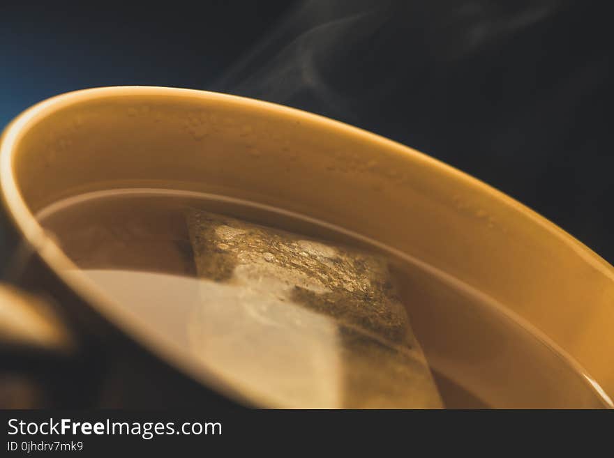 Brown Ceramic Cup With Tea