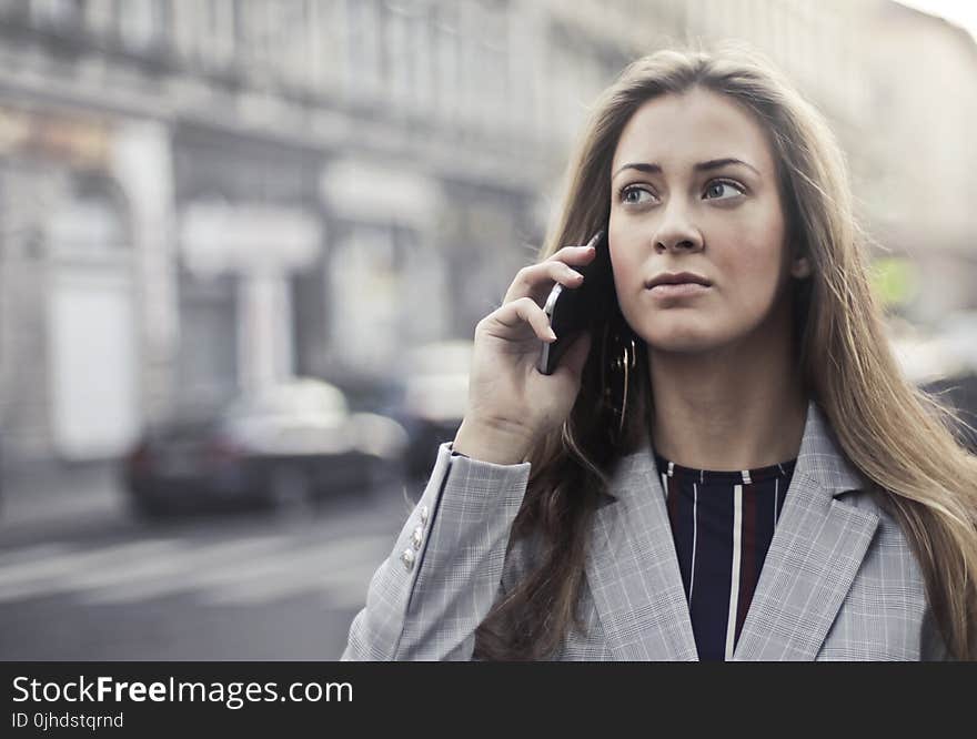 Woman in Grey Notched Lapel Suit