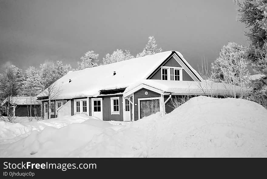 Monochrome Photography of Snow Capped House