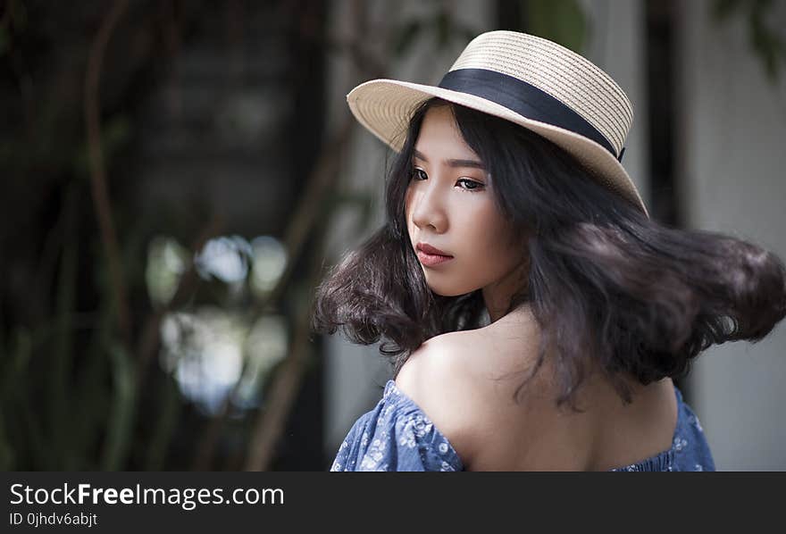 Woman Wearing Fedora Hat and Off-shoulder Top