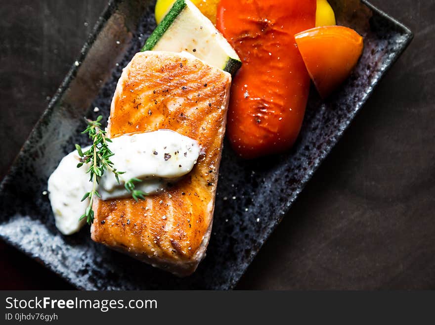 Grilled Salmon Fish on Rectangular Black Ceramic Plate