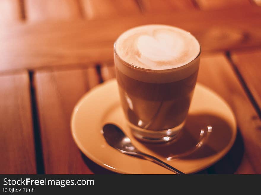 Close-up Photography of Clear Glass Cup With Latte and Tablespoon