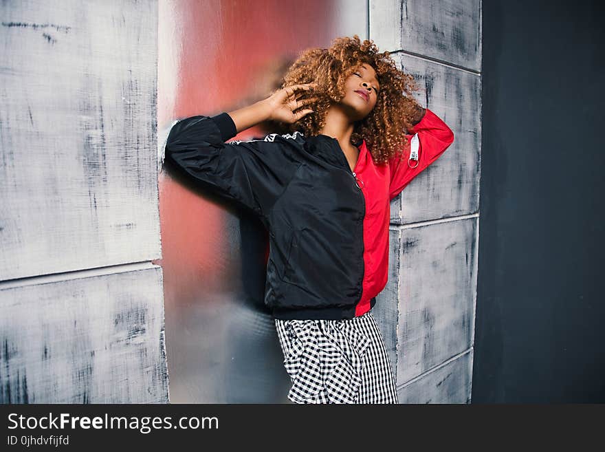 Woman in Red and Black Bomber Jacket