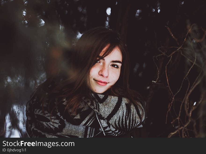 Woman in Black and Gray Sweater Posing Smile for Photo