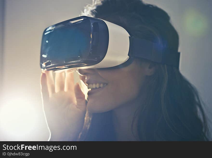 Man Wearing White Virtual Reality Goggles