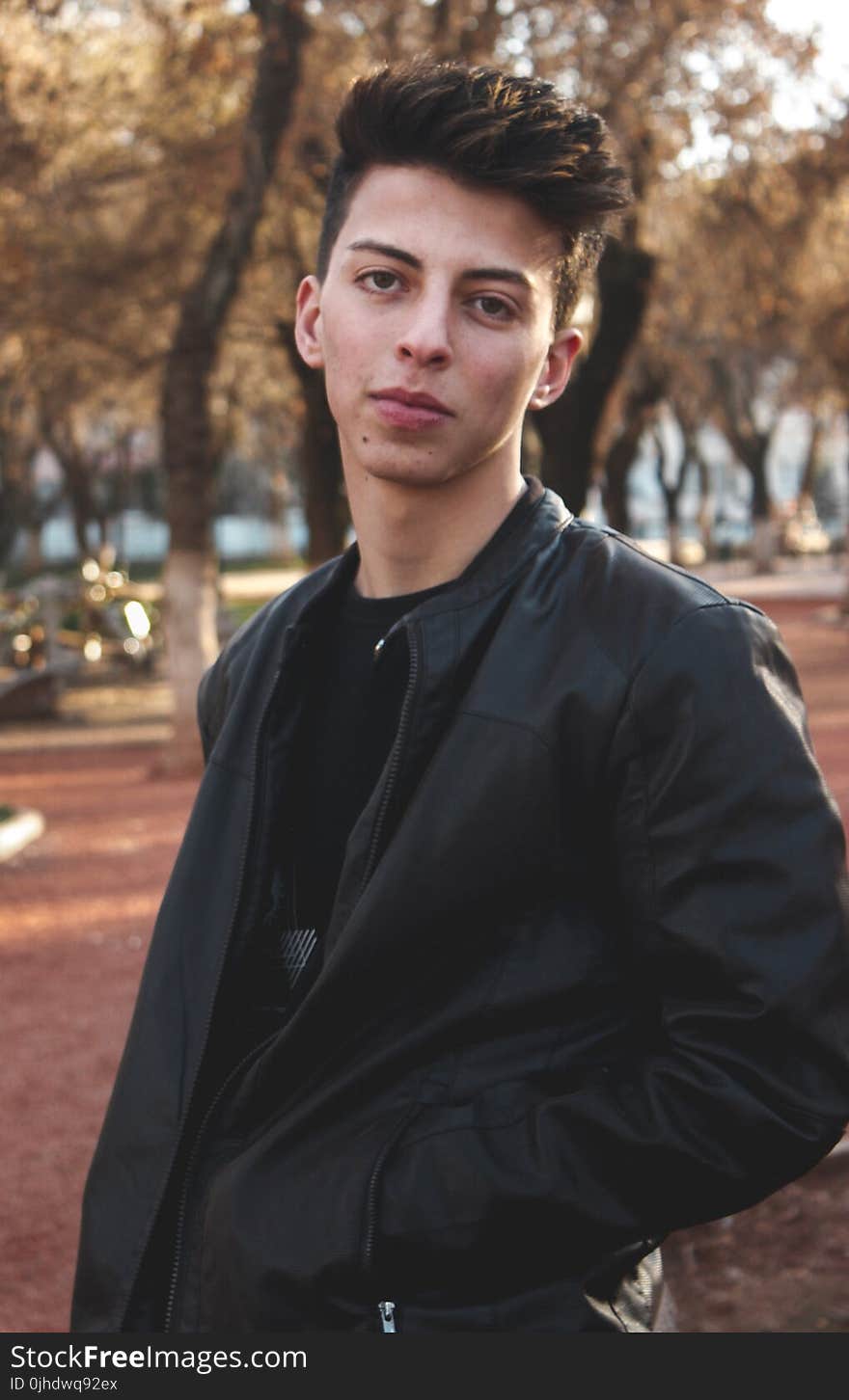 Man Wearing Black Leather Jacket With Black Shirt Photo