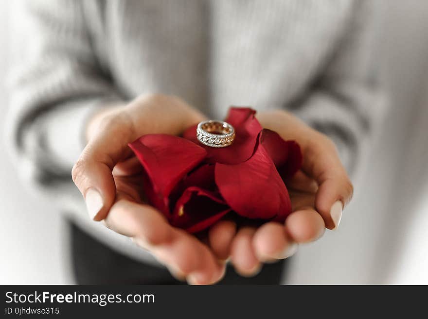 Silver-colored Ring on Persons Hand