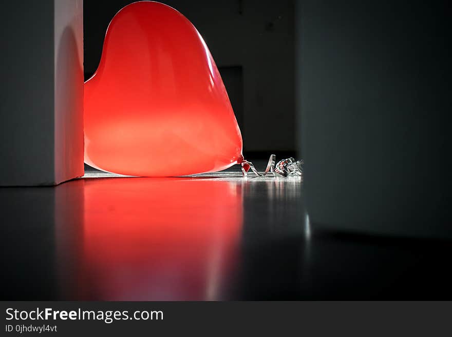 Red Heart Balloon on Top of Floor