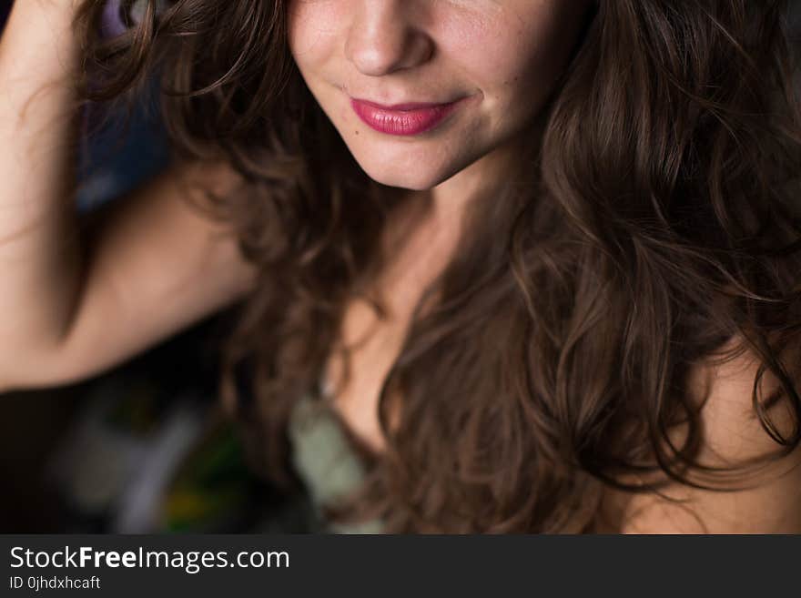 Selective Focus Photography of a Smiling Woman