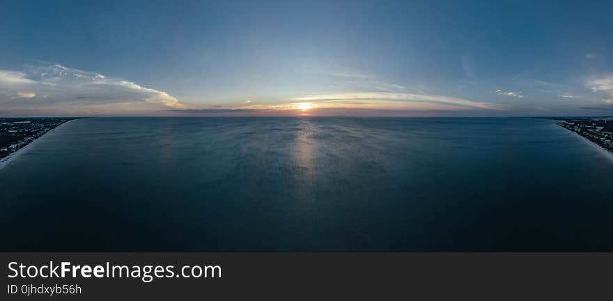 Scenic View of Ocean During Sunset