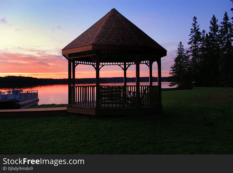 Brown Canopy Tent Near on Body of Water