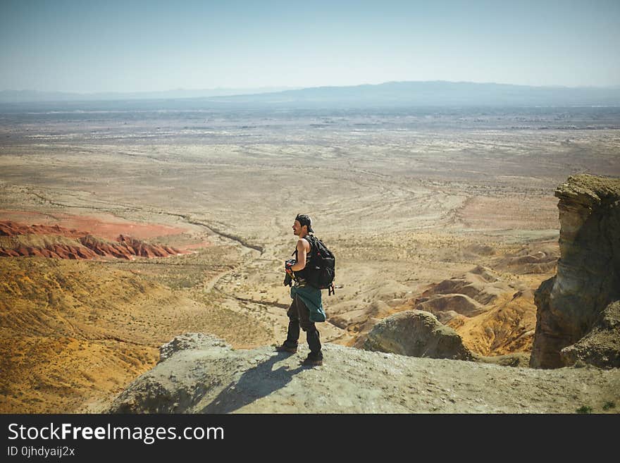 Man Standing on Peak