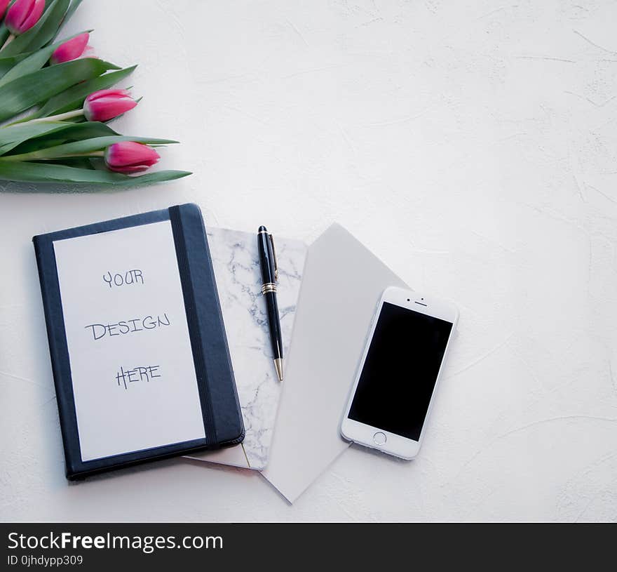 Silver Iphone 6 Beside Black Twist Pen