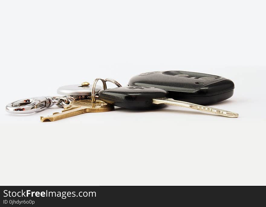 Two Black and Brass-colored Keys With Fob