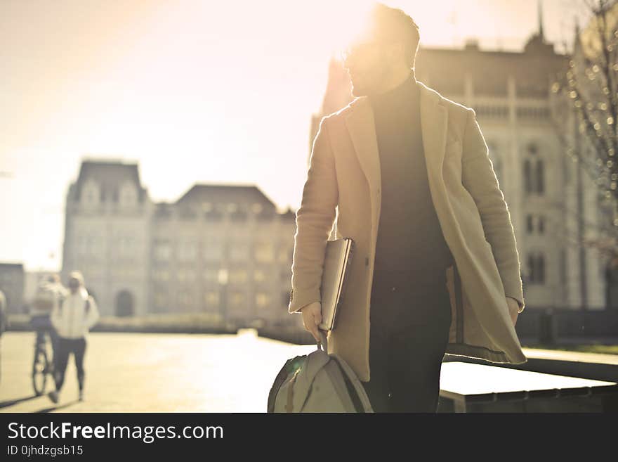 Photo of Man Wearing Brown Coat