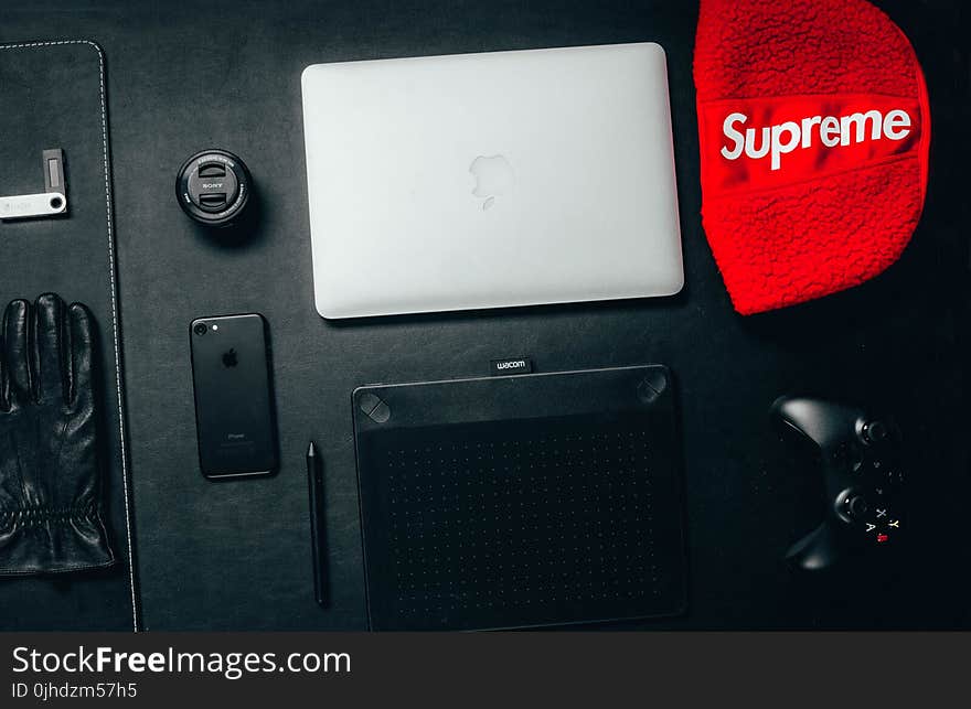 Macbook Beside Red Supreme Textile