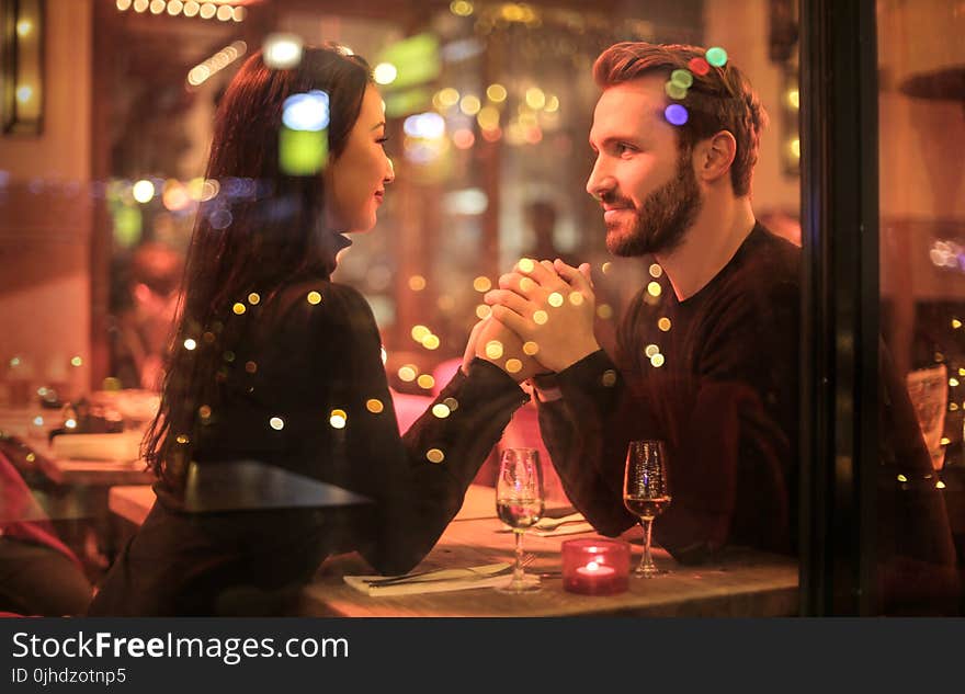 Photography of Couple Holding Hands