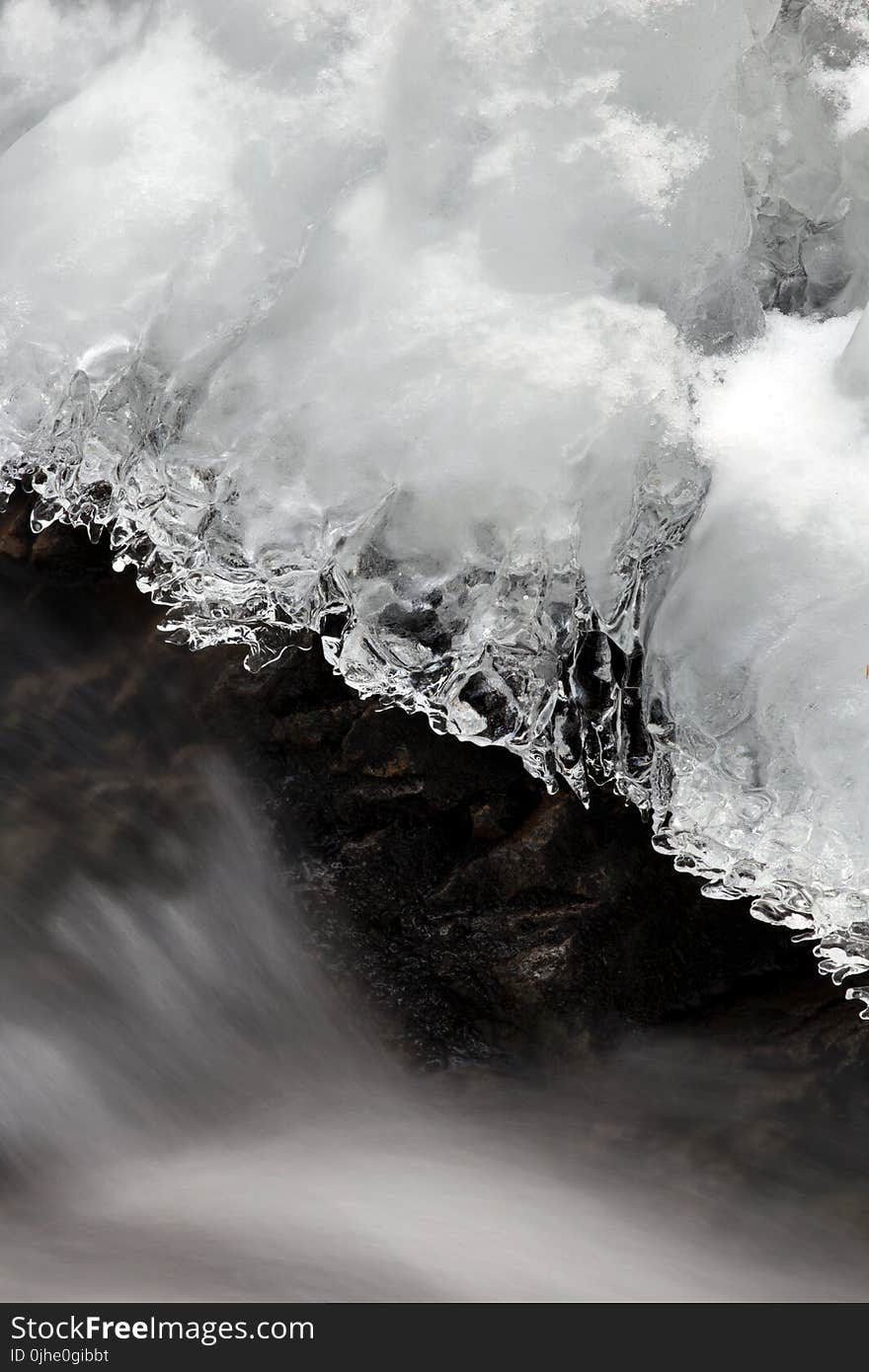 Icicle Above Flowing Water