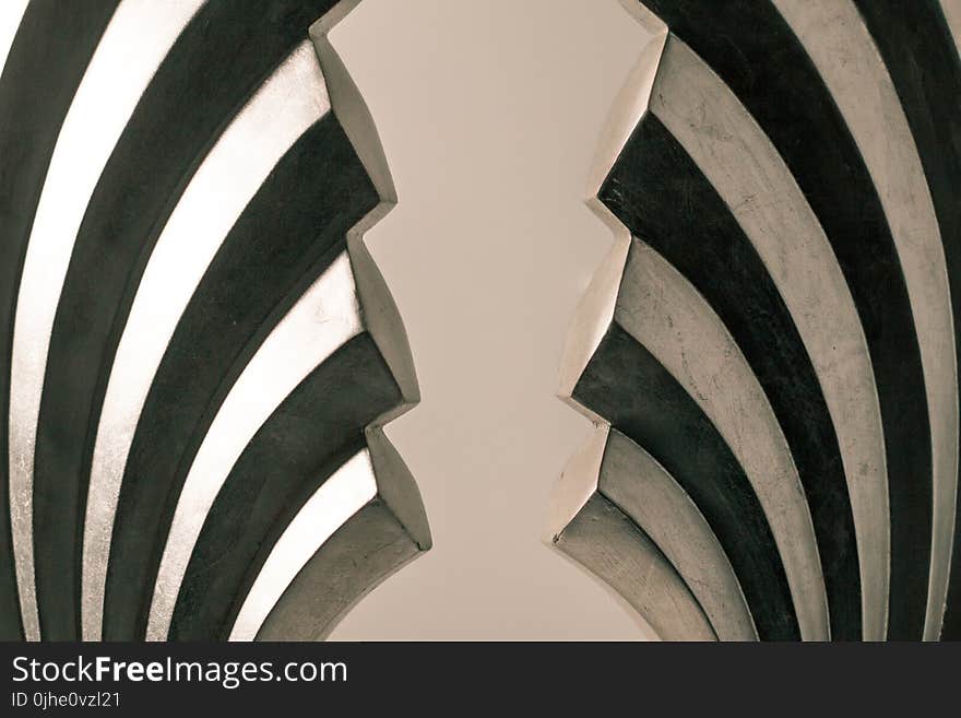 Gray and Black Steel Wall Decoration on White Surface