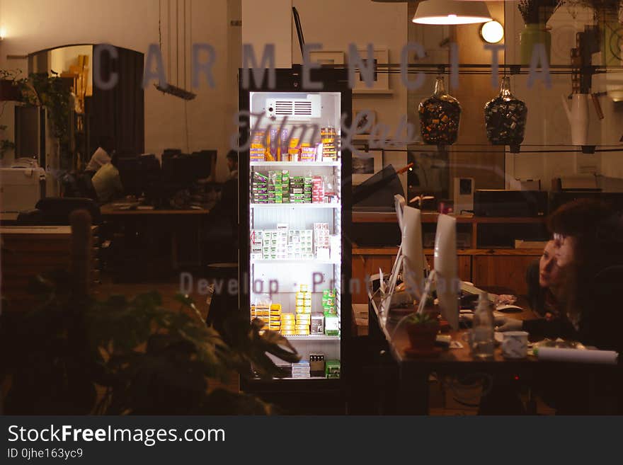 Two Woman Staring at Computer Monitors