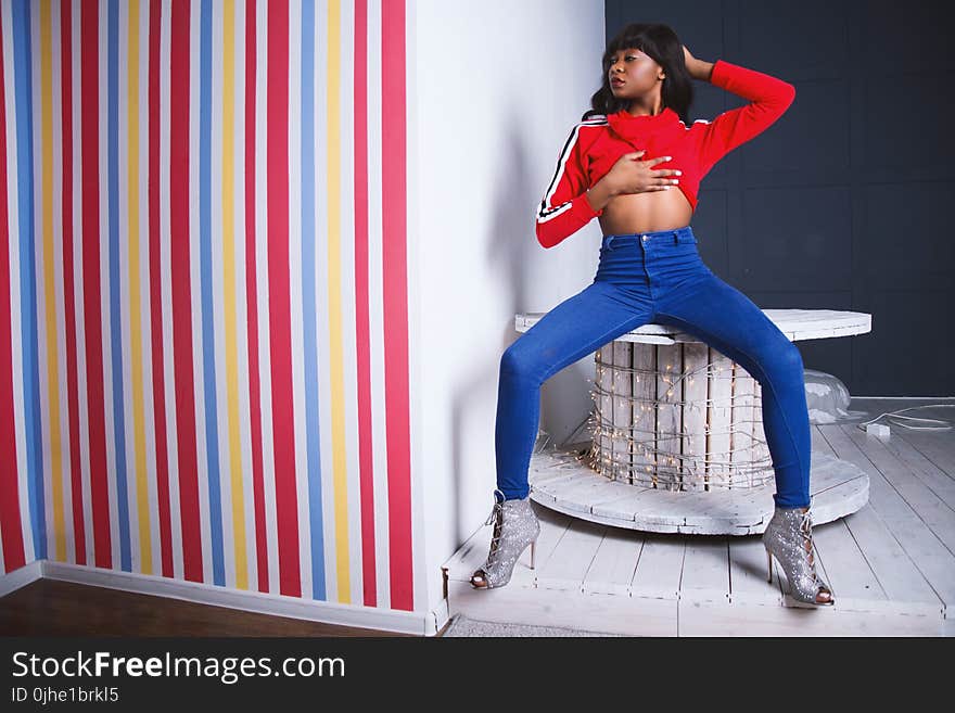 Woman Wearing Blue Denim Pants Holding Her Chest