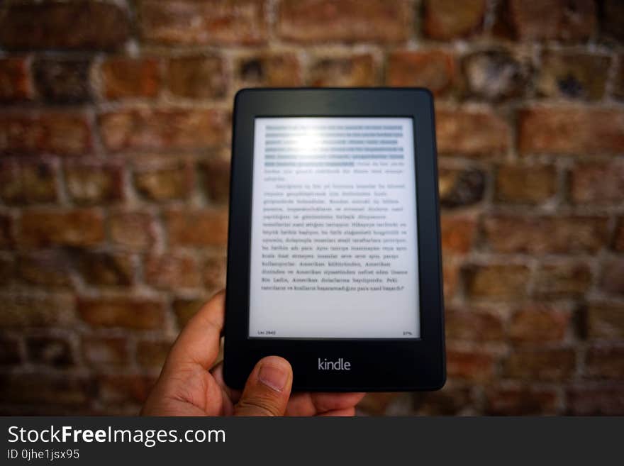 Person Holding Amazon Kindle Ebook