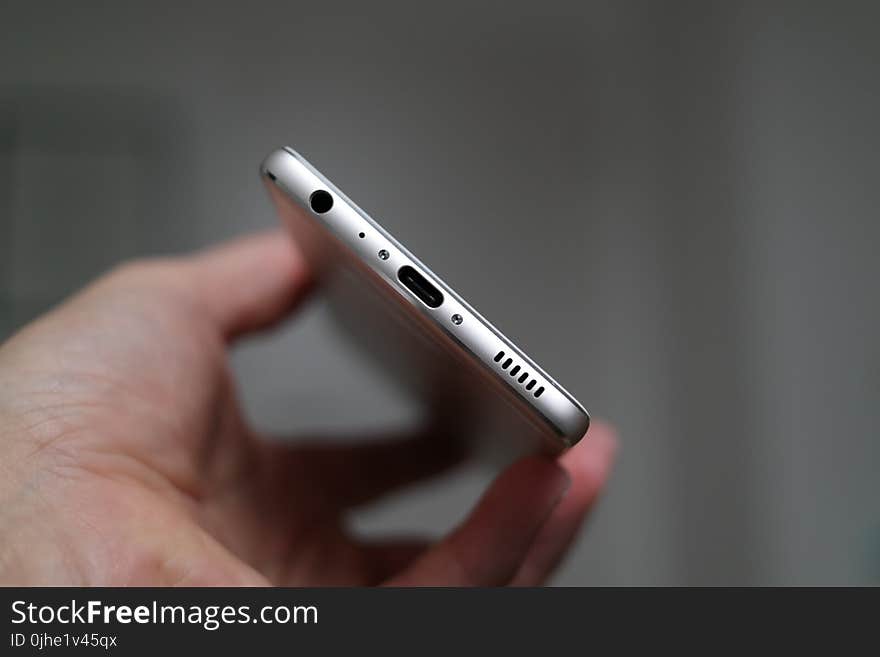 Person Holding Silver Iphone 7