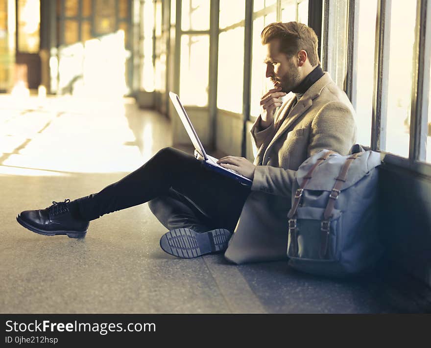 Brown Haired Man Using Laptop Computer