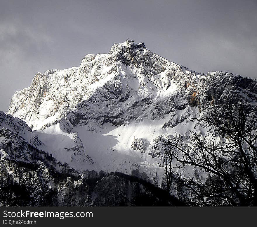 Mountain Cliff Covered With Snow Near Trees Landscape Photo