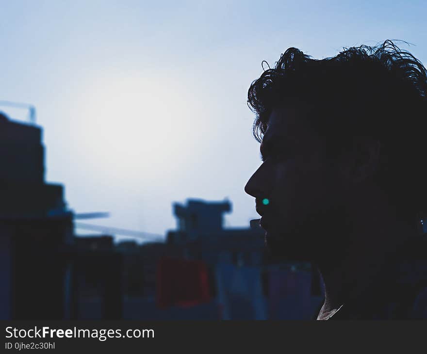 Man Face With a Background of Buildings