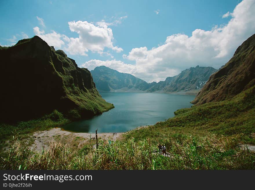 Photography of Mountains Near Body of Water