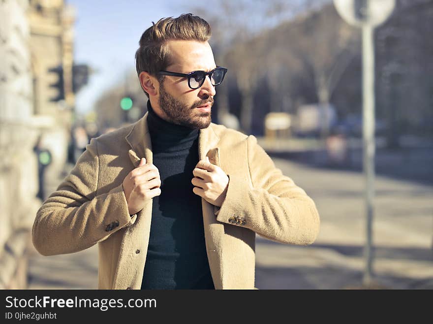 Man Wearing Eyeglasses and Brown Jacket