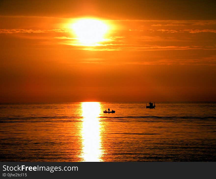 Silhouette of People on Boat during Golden Hours