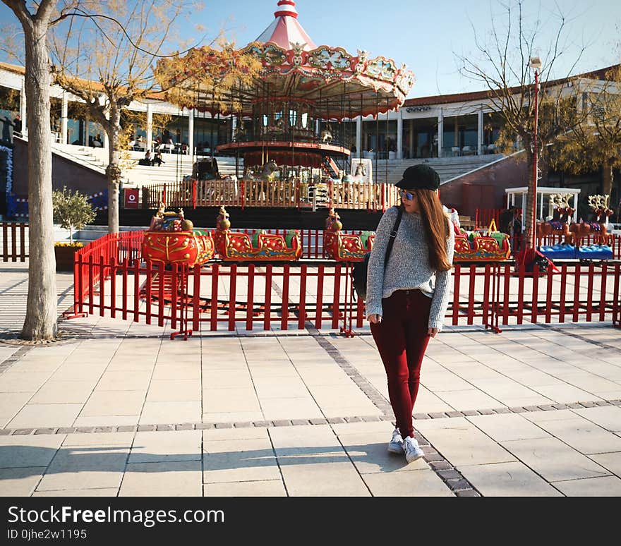 Woman Wearing Gray Sweater and Maroon Pants