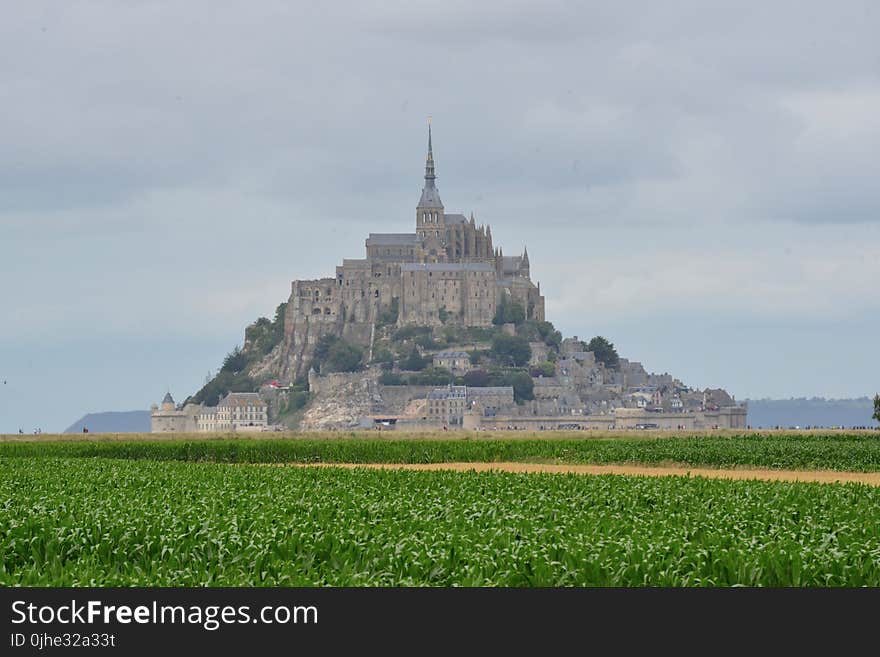 Mont Saint-michel Under White Clouds and Blue Sky