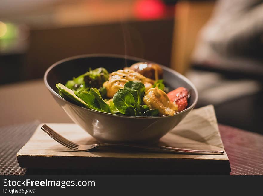 Round Stainless Steel Bowl With Cooked Meat and Vegetables