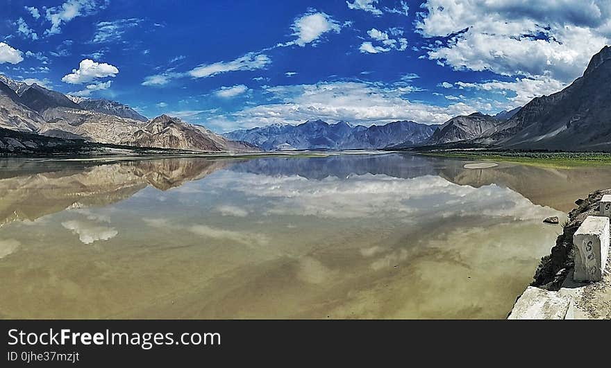 Body of Water Near Mountain