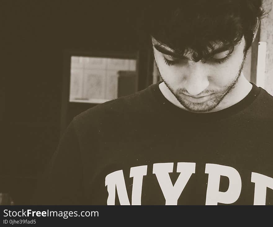 Photo Of Man Wearing NYPD Crew-neck Shirt