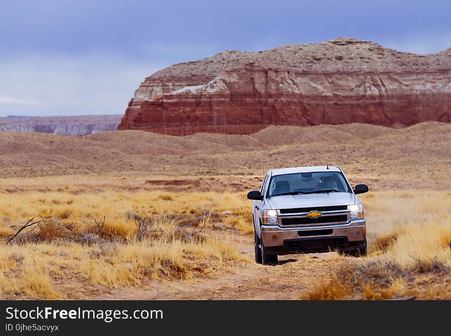 White Chevrolet Vehicle on Dessert