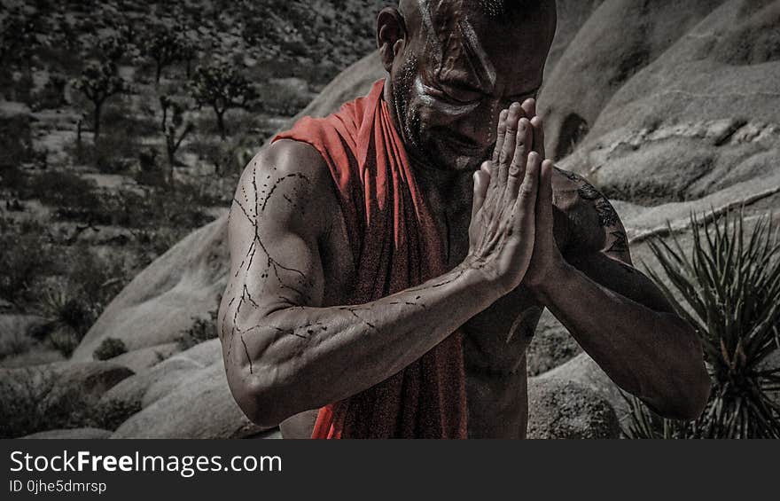 Man Wearing Red Scarf Praying